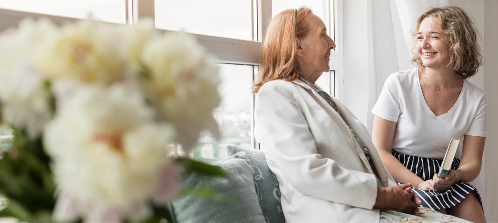 Caregiver companion sharing a warm moment by the window